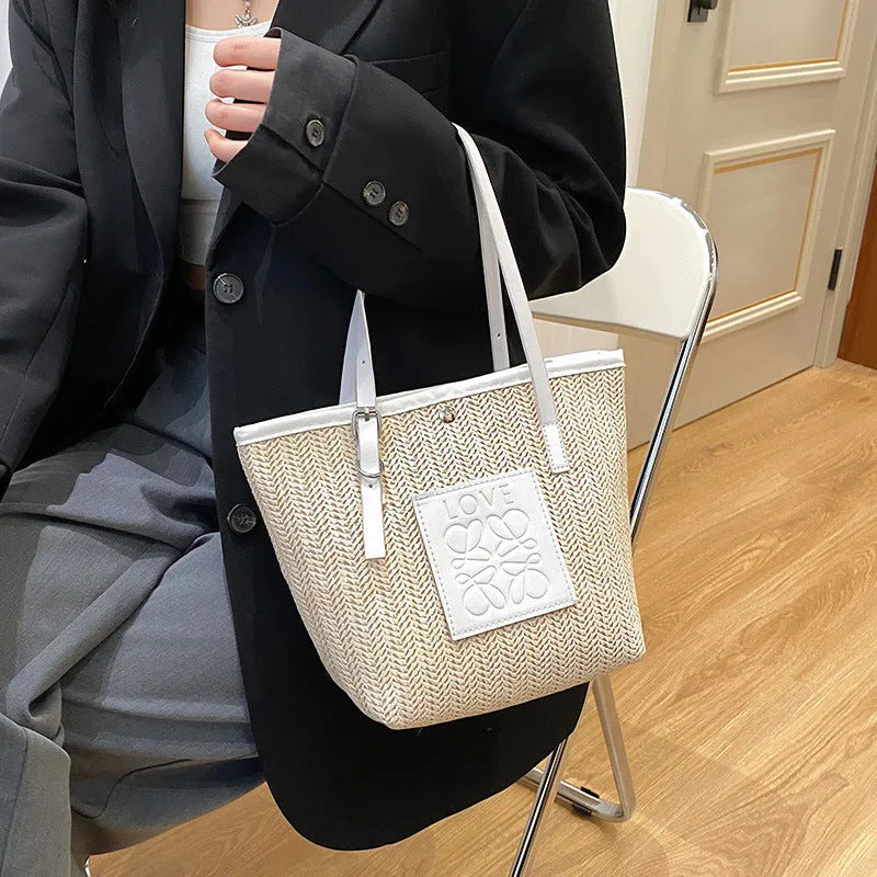 Women's retro style straw woven shoulder bag in black with large capacity and three-dimensional pocket