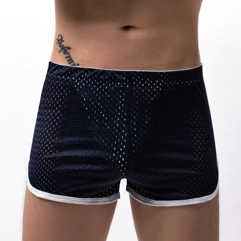 Men's black three-point boxer shorts made from a knitted cotton and nylon blend on a plain background.