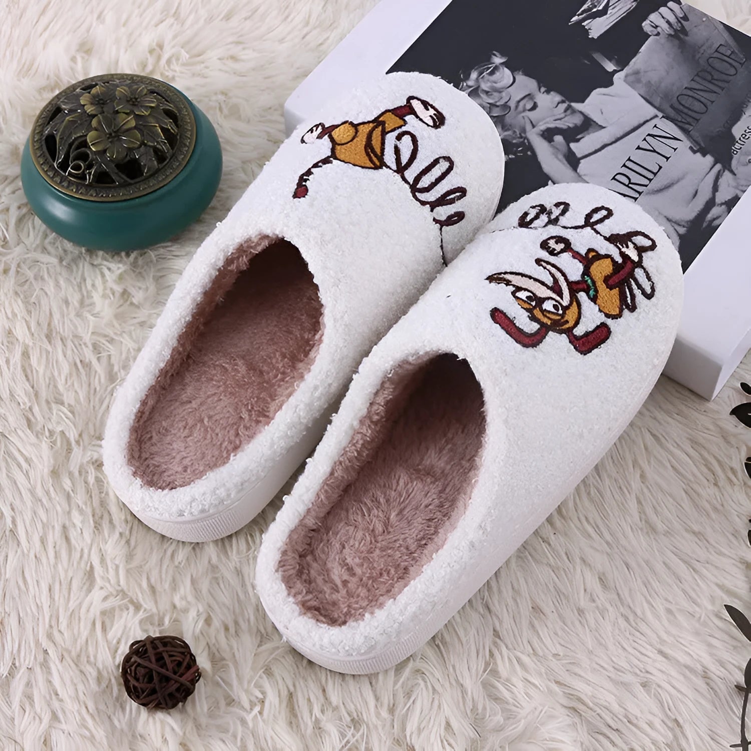 White fluffy cartoon slippers with a non-slip rubber sole and toe holder design