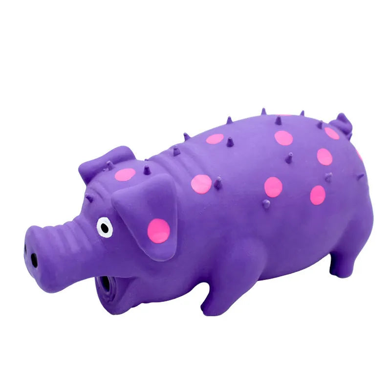 Pig-shaped latex dog chew toy with textured surface and squeaker in various colours