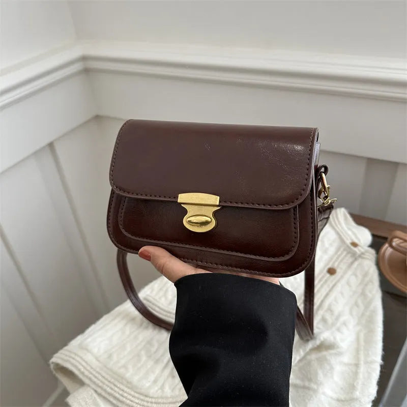 Small horizontal square handbag in soft PU leather, shown in black, brown, dark brown, and light brown.