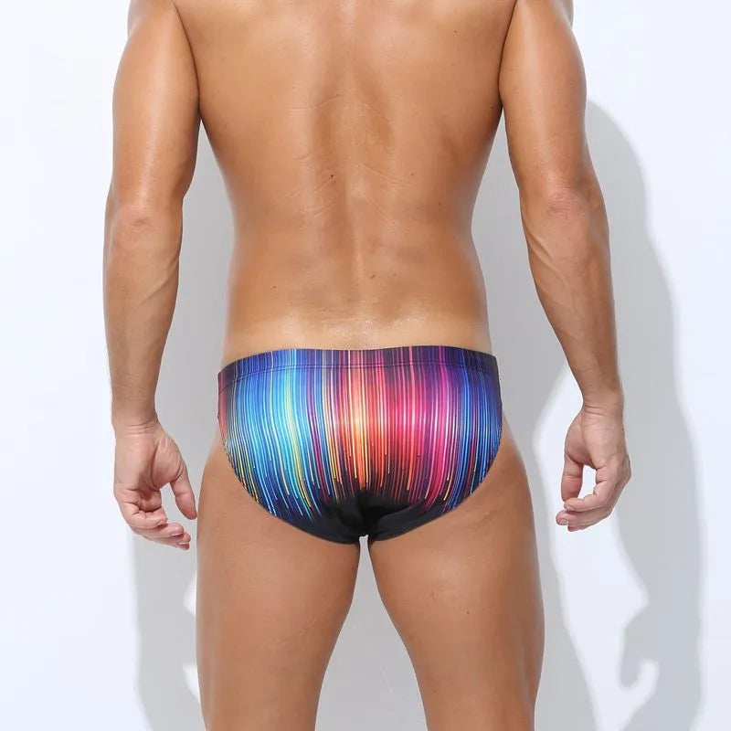 Men's printed swimming trunks in polyester fabric showing Cyber, Ice Cream, Streamer, and Skull design options.