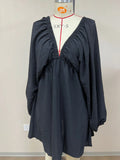 Women's apricot V-neck dress with long puff sleeves and a flounced swing skirt.