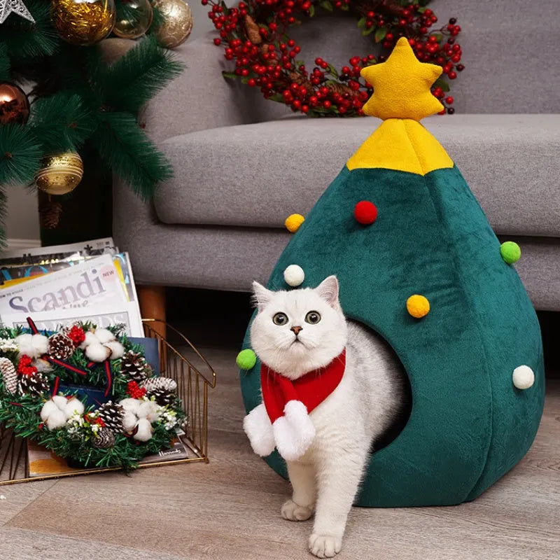 Red Christmas tree-shaped plush cave bed for cats and small dogs on a white background.