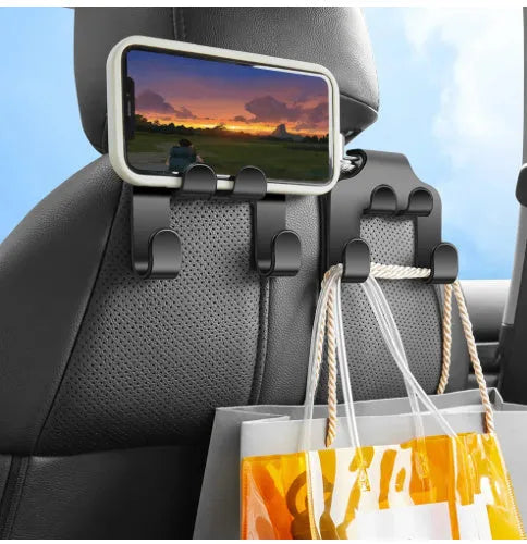 Pack of two black ABS plastic multifunction car hooks for mounting on dashboard or console.
