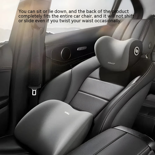Black memory foam car lumbar support pillow and matching headrest pillow on a car seat.