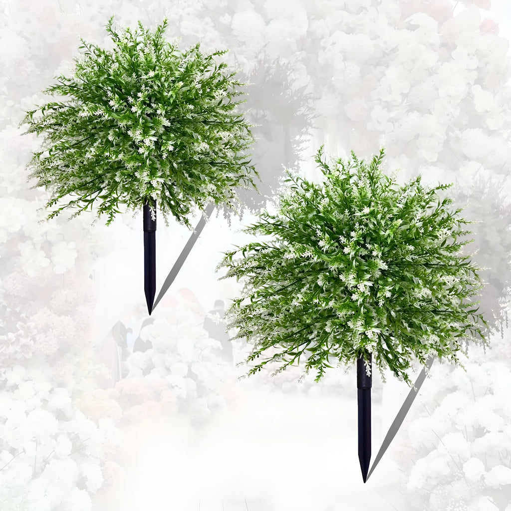 White plastic artificial lavender stem on a table, used as a decorative accent