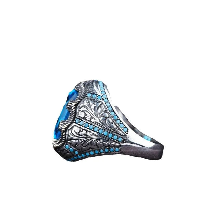Geometric antique silver alloy ring with blue zircon stone showing European American styling