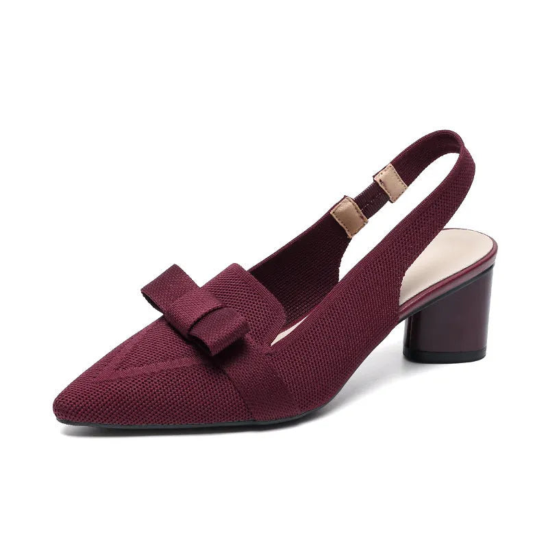 Women's closed toe high heel sandals with an ankle back strap in a pointed toe design on a rubber sole