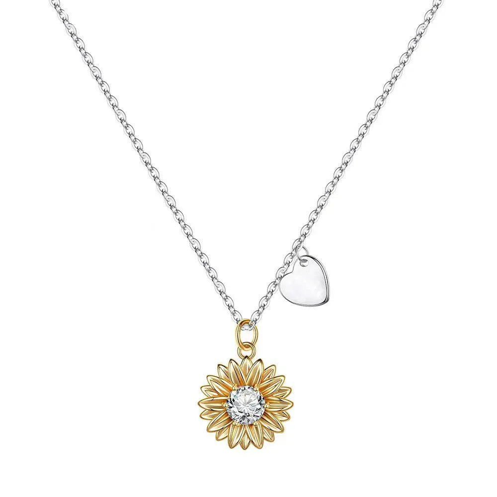 Sunflower and daisy sterling silver pendant on an adjustable cross chain necklace.