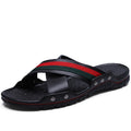 Men's blue cowhide leather flip-flops with a non-slip PU sole on a sandy beach.