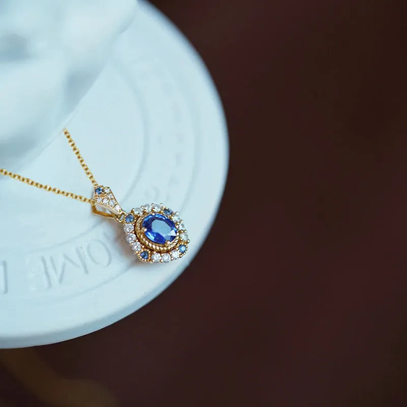 Yellow gold plated women's necklace with mixed gem pendant on an adjustable box chain.