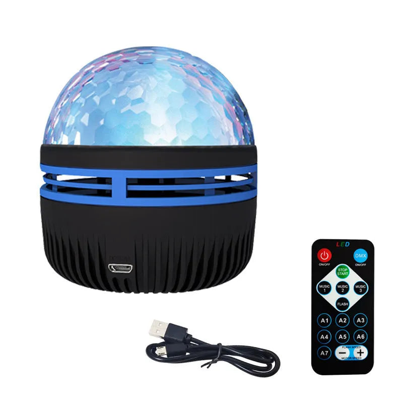 LED star galaxy projector lamp with colourful rotating patterns on a bedroom table