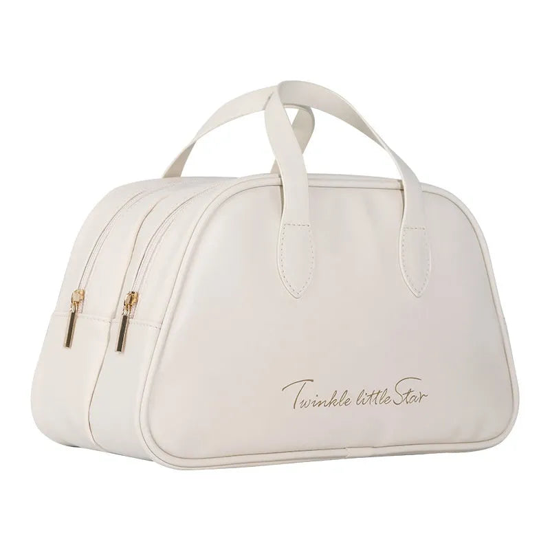 PU leather travel toiletry bag in classic black colour, showing large capacity and zipped compartments.