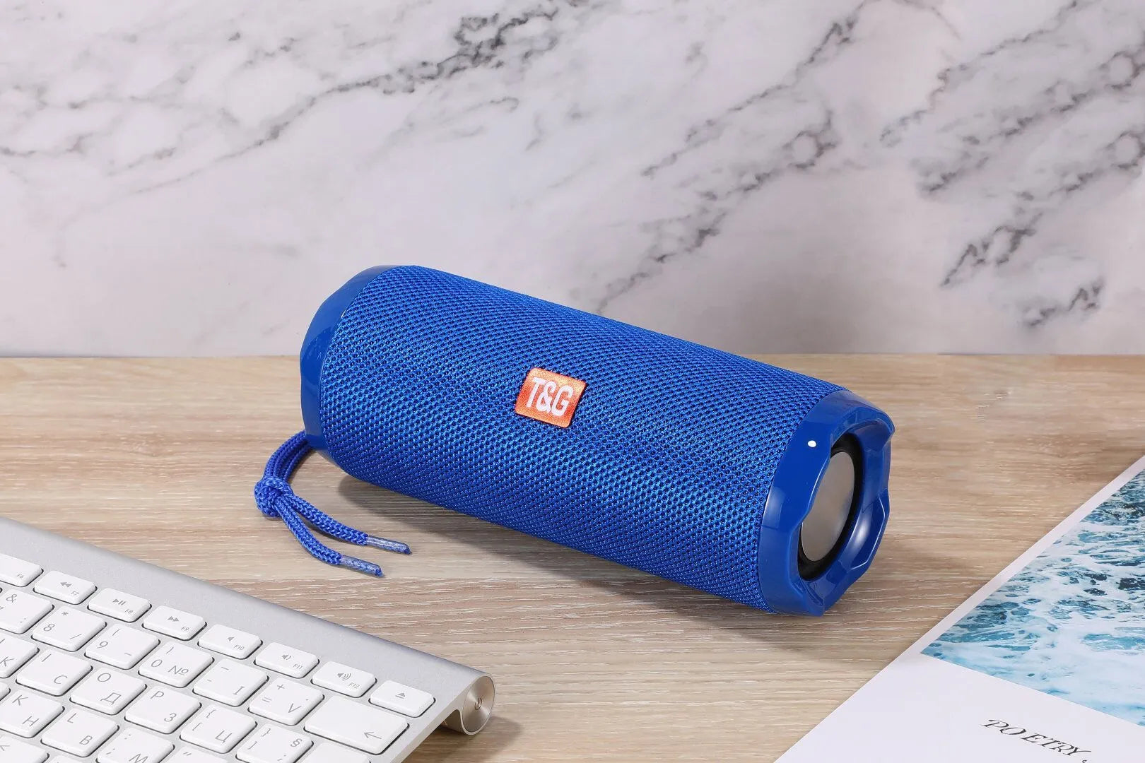Fabric portable Bluetooth speaker with integrated card holder in multiple colour options.