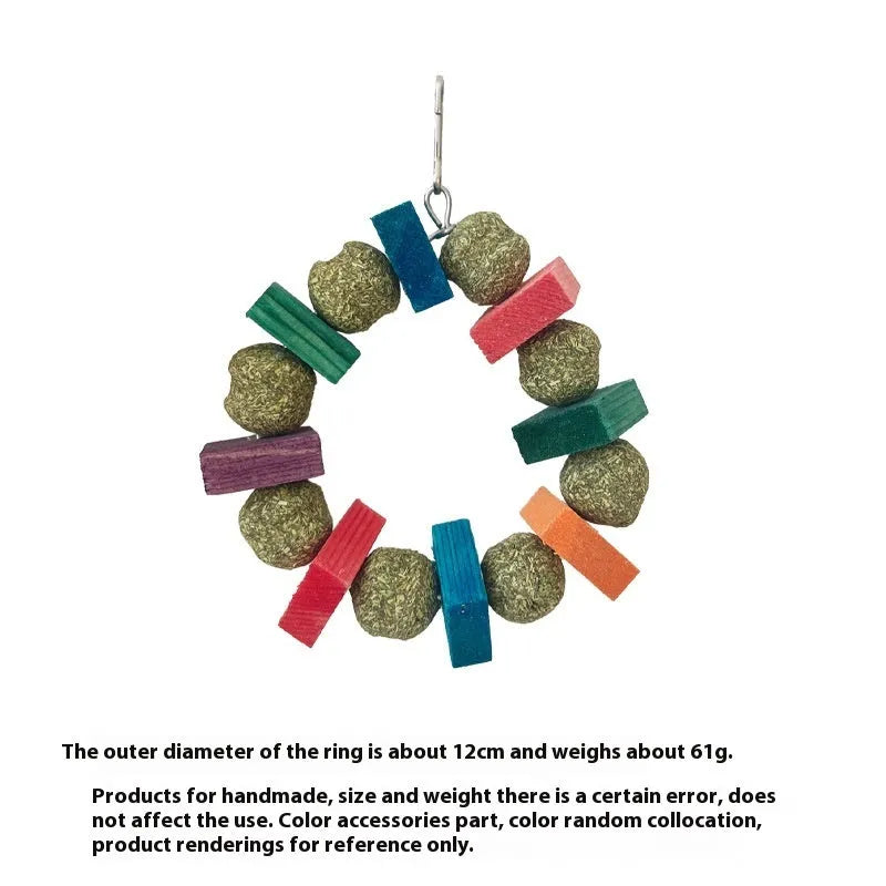 Hamster chew toy featuring applewood sticks and decorative straw balls with colourful sequins