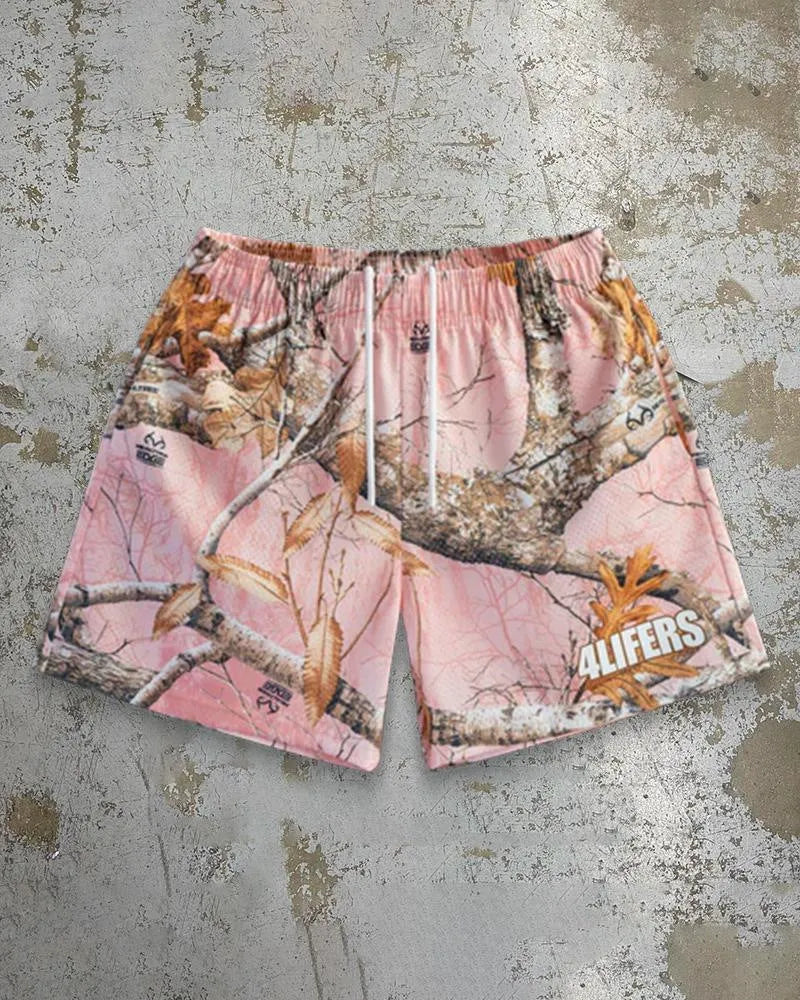 Man wearing loose-fitting digital print beach shorts made from quick-drying milk silk polyester.