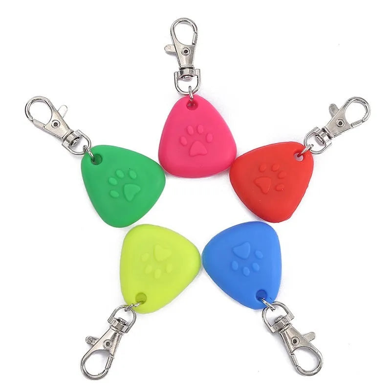 A silicone triangle-shaped pendant ornament for pets, shown in one of five colours: red, pink, blue, green, or yellow.