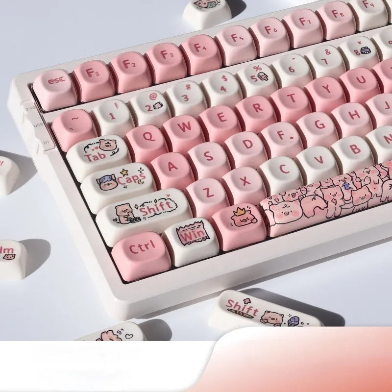 Pink PBT key cap with fragrant pig design on all five sides, shown with keycap puller tool