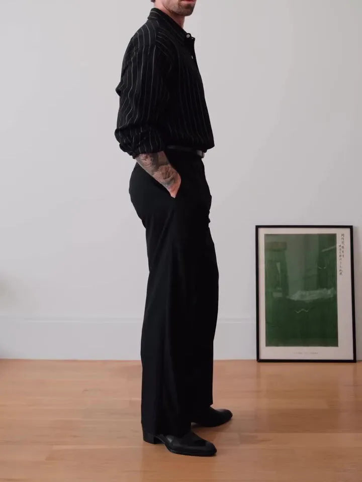 Men's black pinstriped button-down shirt showing regular fit and traditional button-down collar