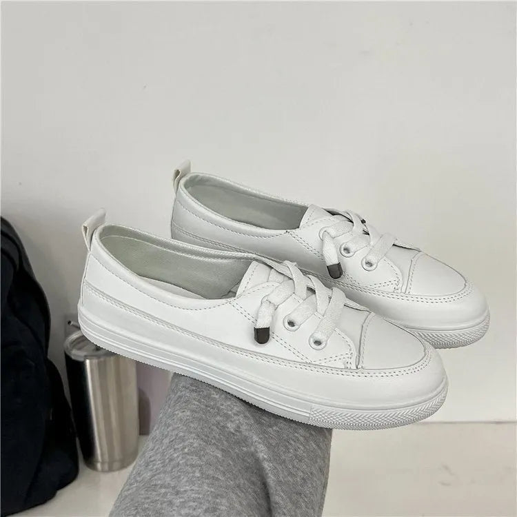 White women's sports breathable shoes with flat heel, round toe, lace-up front, and rubber sole