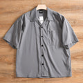 Men's lightweight loose short sleeve solid colour summer shirt in Army Green on model