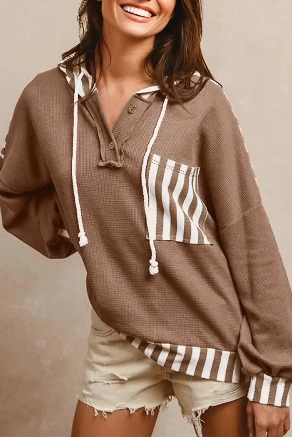 Straw yellow waffle texture hoodie with striped patchwork and button neck closure
