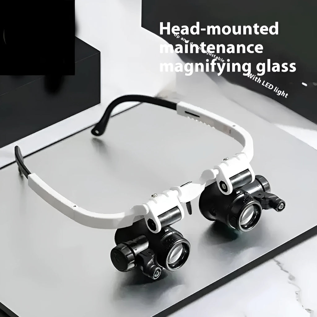 White head mounted magnifying glass with 30 lenses and light on a workbench with circuit board