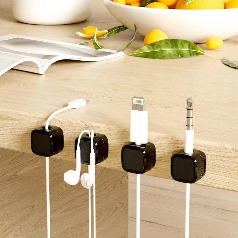Magnetic cable management clips in white and black with adhesive backing
