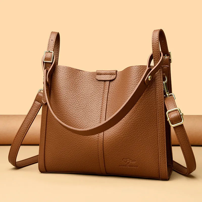 Brown retro ladies shoulder bag with zip compartments showing vertical square shape and single strap