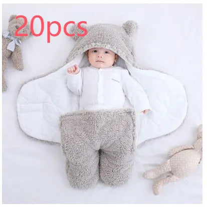 A baby quilted sleeping bag wrapper in a plain colour, showing its quilted pattern and soft cotton blend fabric.