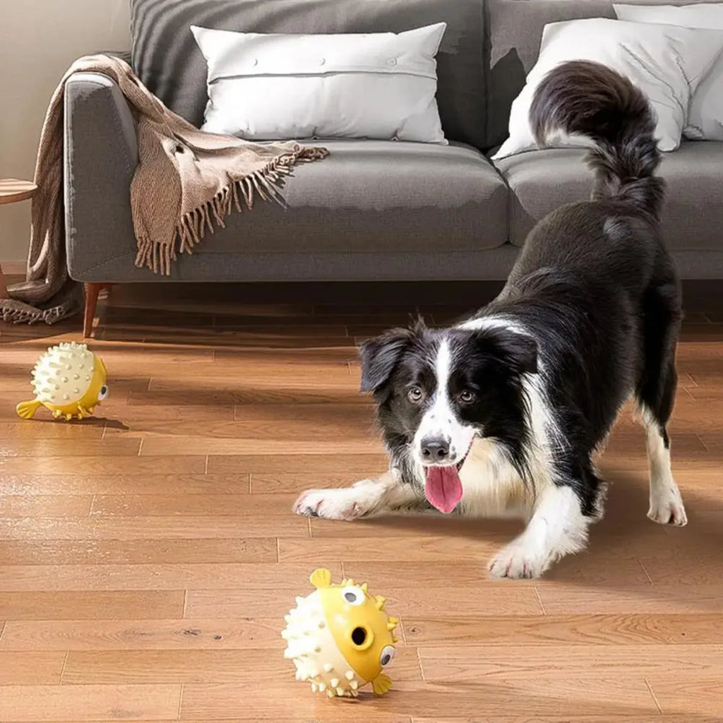 Yellow fish-shaped dog chew toy with textured surface and squeaker for aggressive chewers