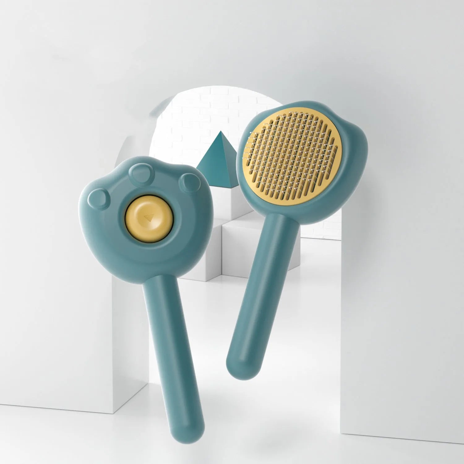 Blue pet grooming comb with stainless steel needles and a detachable cleaning cartridge on a white background.