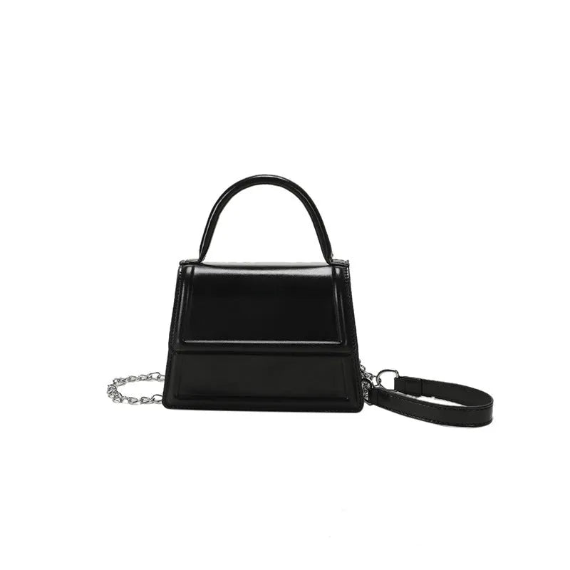 Retro square crossbody bag in PU leather with sewing line details, shown in a selection of colours.