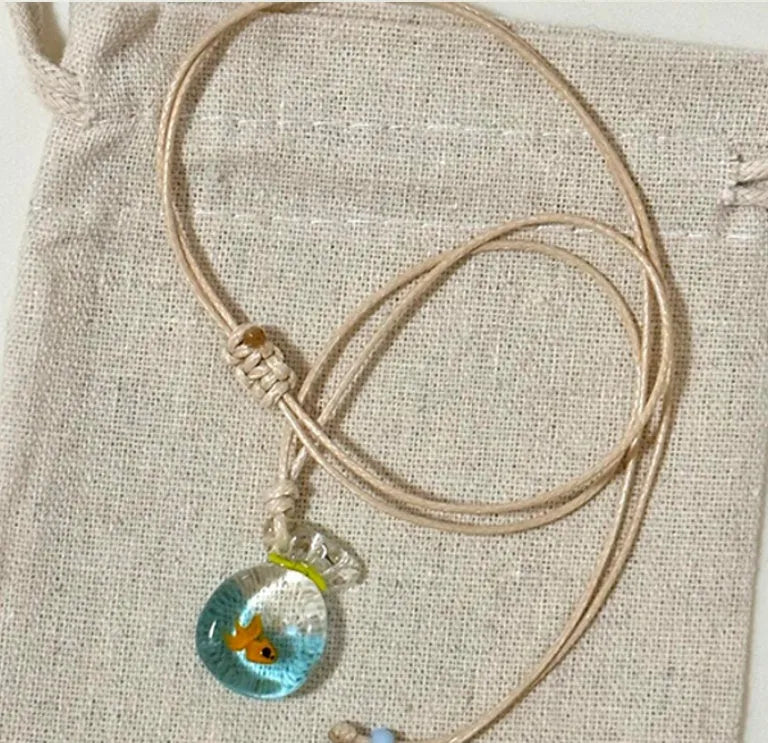 Women's necklace with coloured glaze skirt pendant on cotton linen clavicle chain