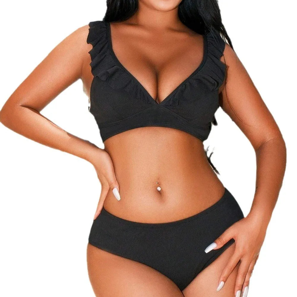 Retro striped split bikini swimsuit in black and white stripes on mannequin