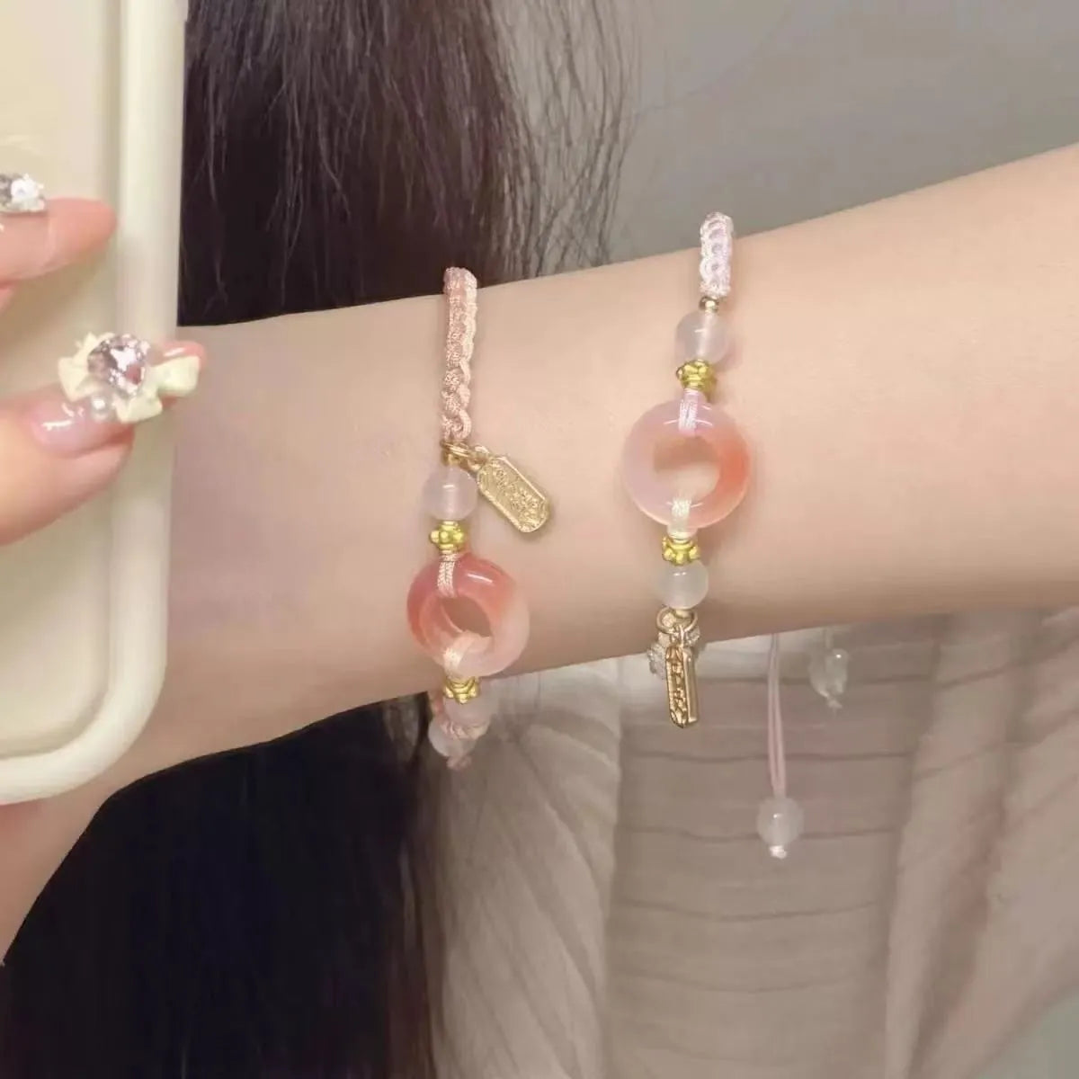 DIY woven watch band with peach blossom design in green, pink, and black colour options.