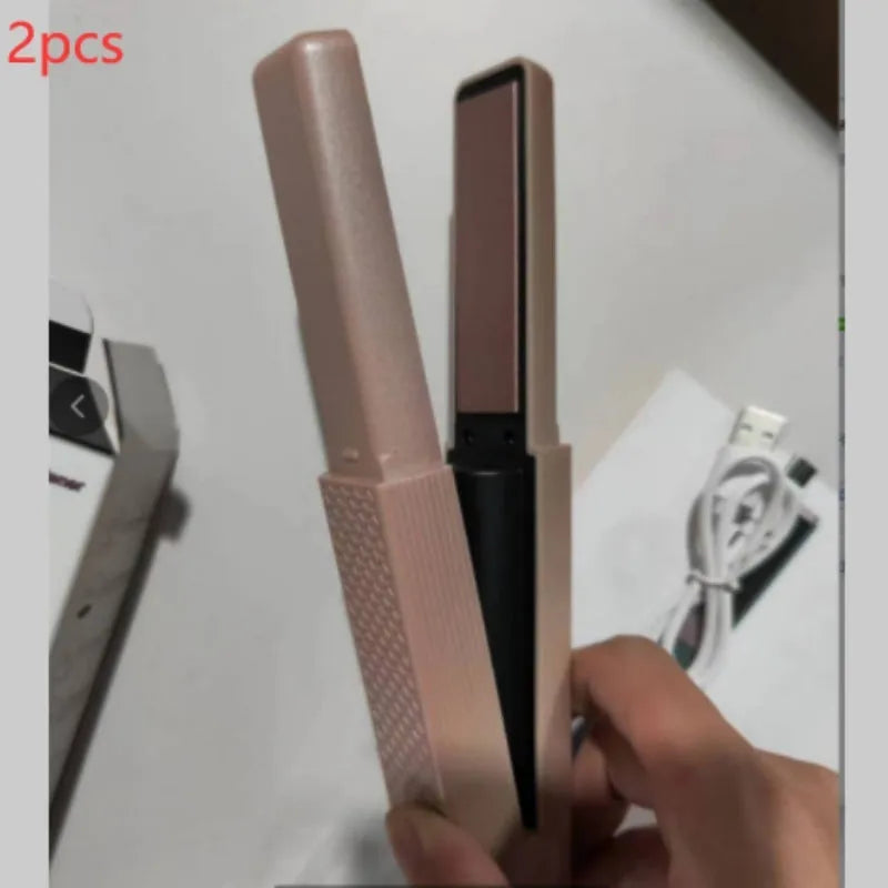 Pink and green mini cordless USB hair straightener with ceramic plates open on a white background.