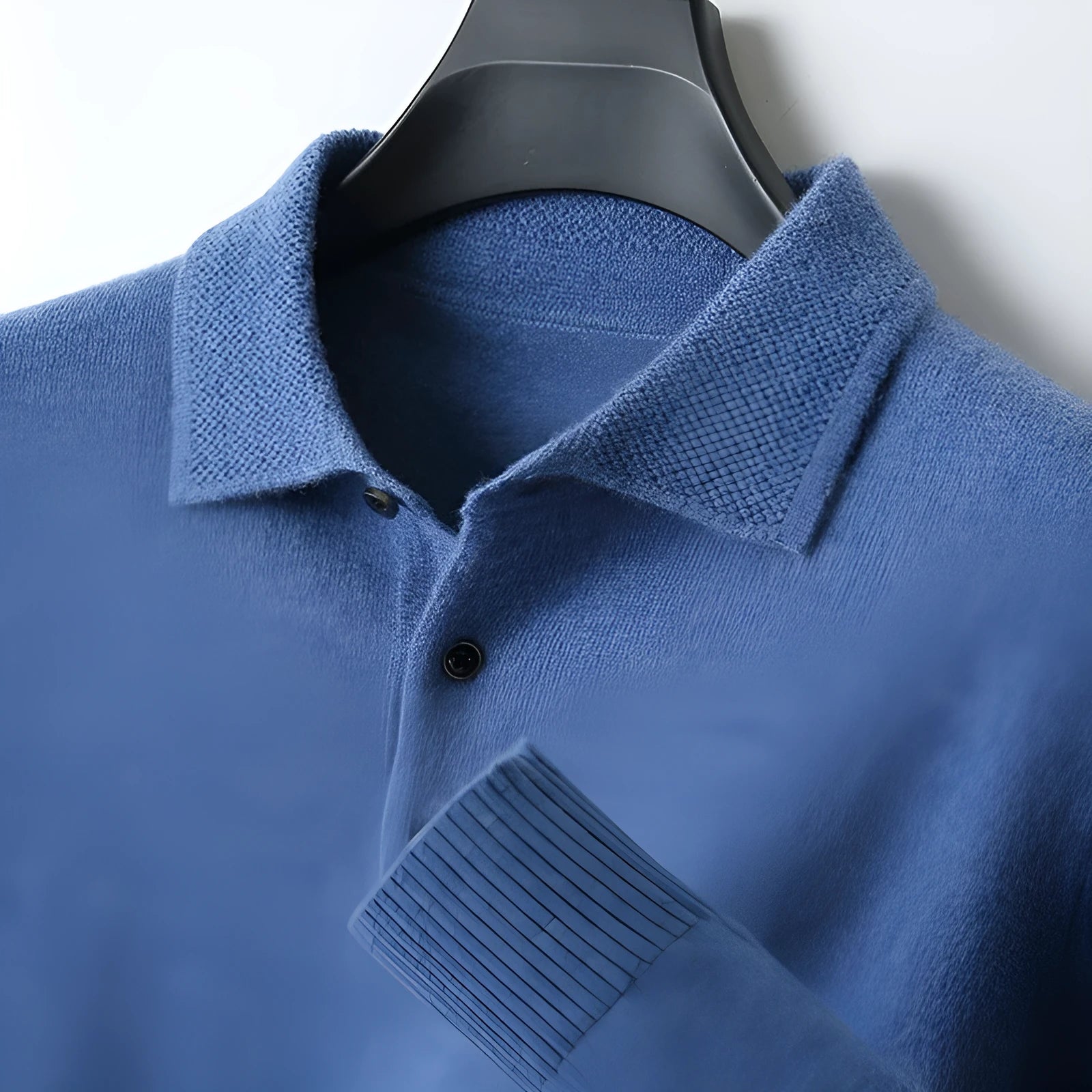 Men's grey wool pullover sweater with a polo collar and long sleeves on a hanger.