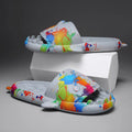 Casual open-toe shark design slippers in EVA material on a colour selection background.