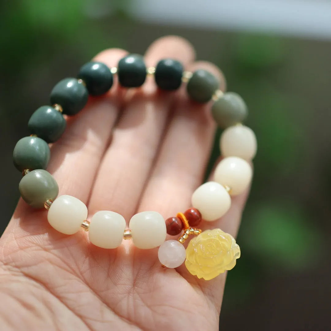Gradient white jade Bodhi root bracelet with natural beeswax lotus charms, 10mm flower shape