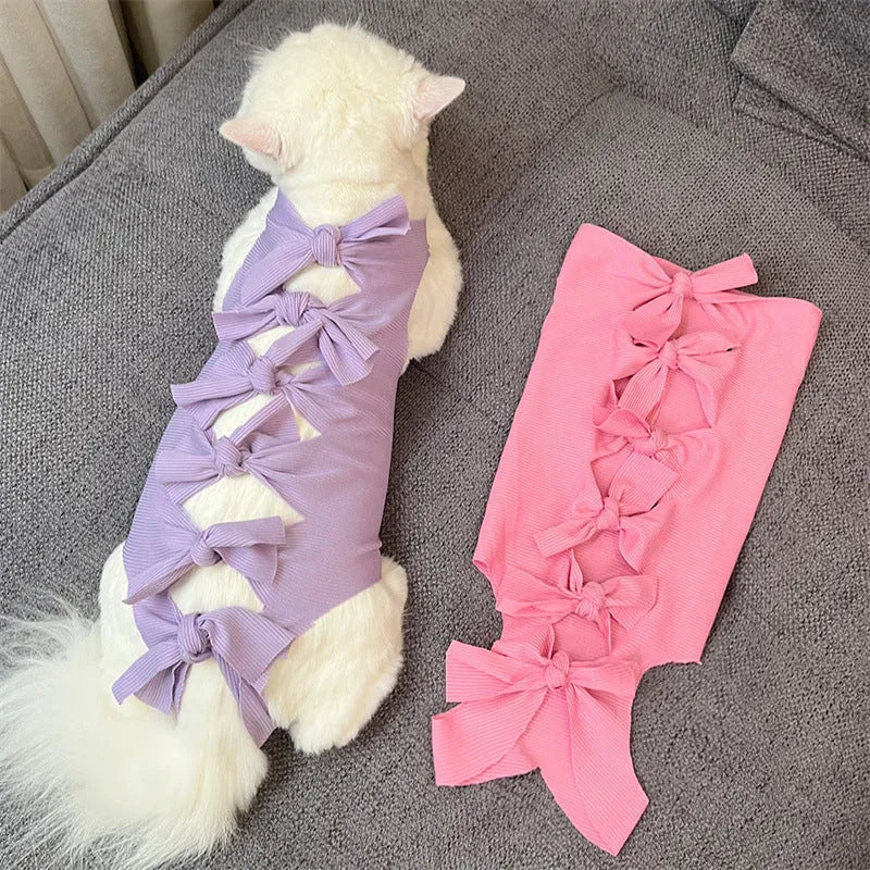 Blue lace-up polyester sterilisation clothing for a cat, shown on a size chart for S, M, and L.