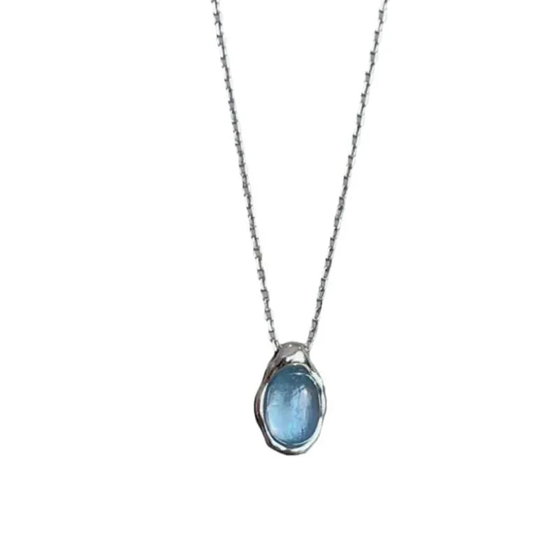 Women's navy blue geometric water drop pendant necklace on an adjustable copper chain.