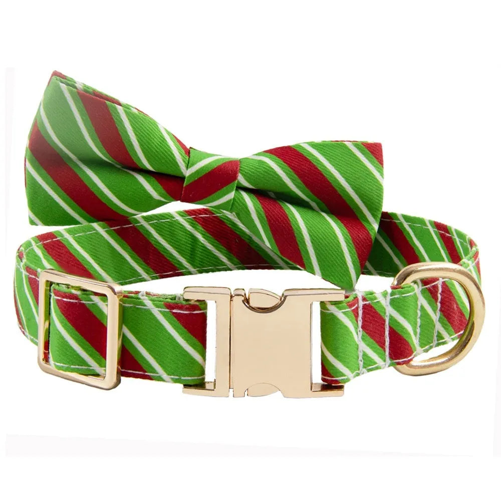 Striped green personalised dog collar with engraved text and a matching fabric bow knot attached.