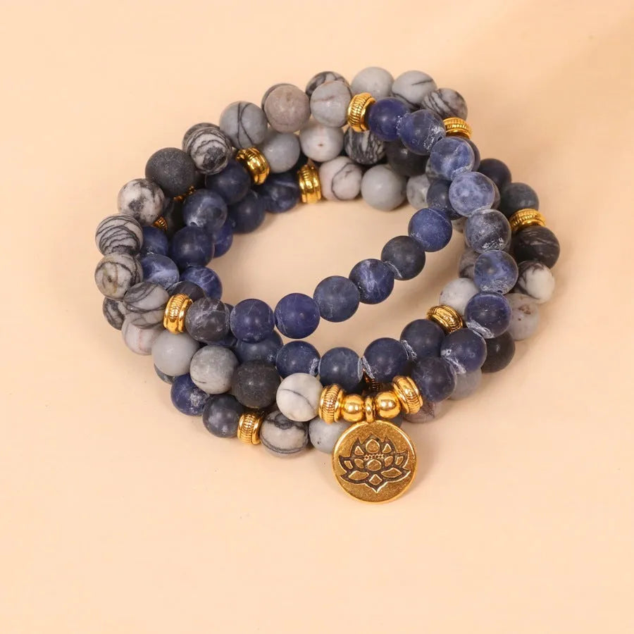 Blue multi-layer bracelet with patterned network stone beads on wrist
