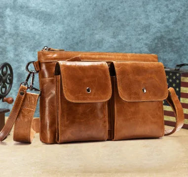 Men's genuine leather crossbody messenger bag in black solid colour on white background
