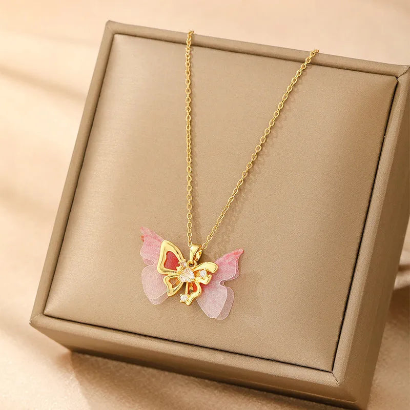 Women's copper necklace with electroplated finish showing heart, butterfly, cross, and round diamond pendant options