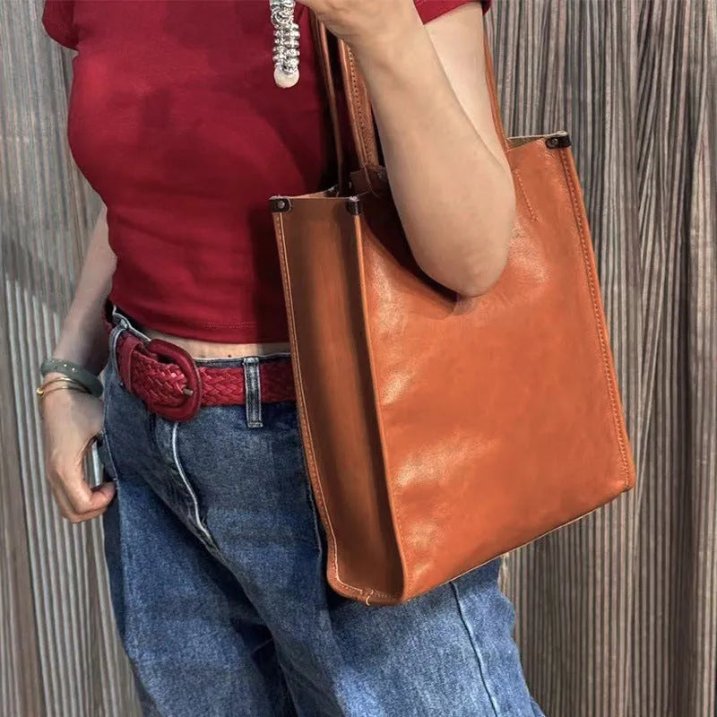 Large capacity genuine leather city commuter shoulder tote bag in black, soft square vertical shape with slit pocket