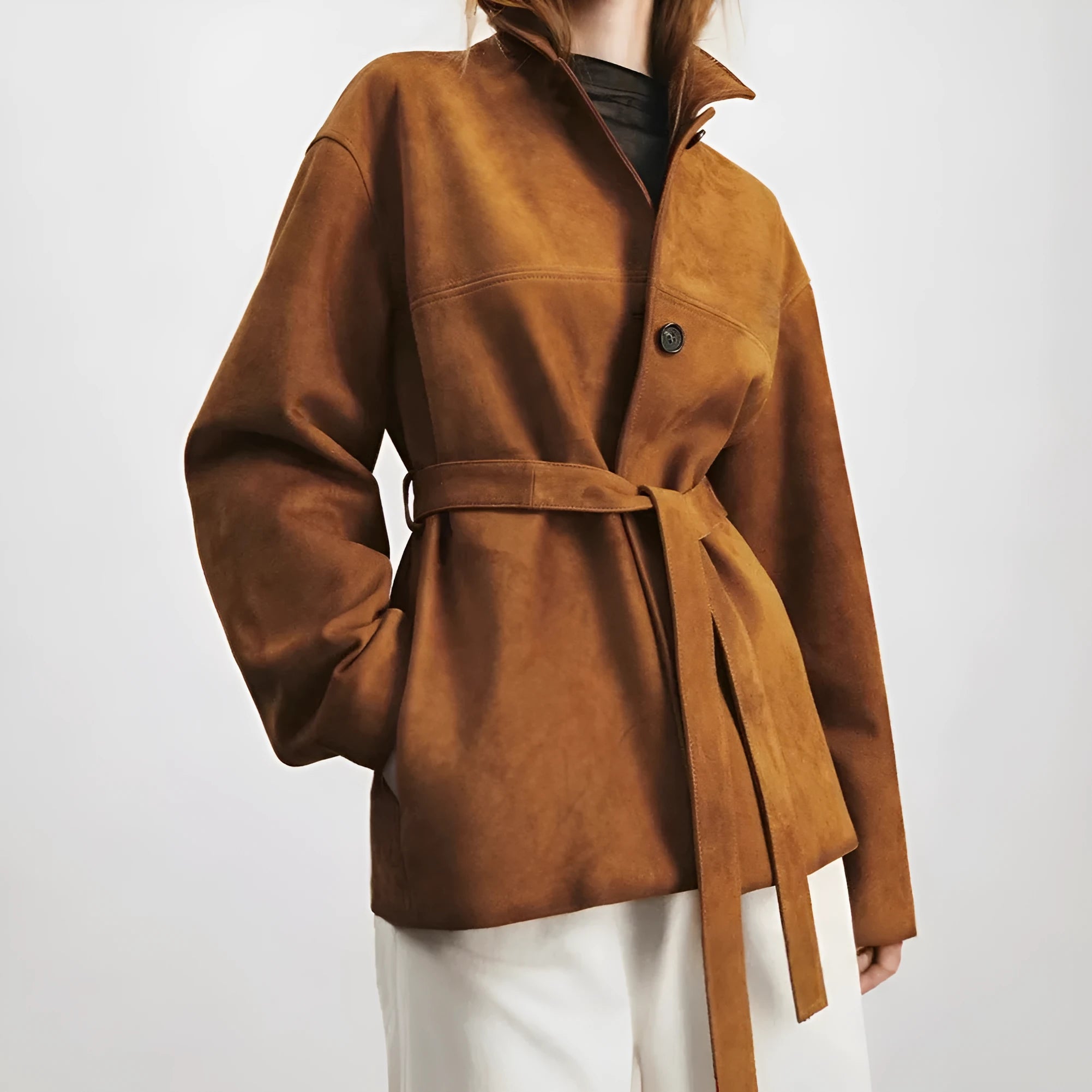 Women's caramel mocha cashmere coat with leather stitching and peter pan collar in art retro style