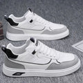 Men's low-top canvas board shoes in beige with leather stitching detail on a white background.